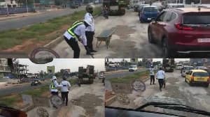 Viral Video of Ghana Police Officers Fixing Highway Potholes Sparks Mixed Reactions Online