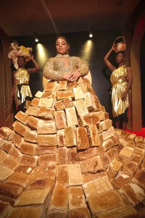 BBC/GIFT UFUOMA Reality TV star Queen Mercy Atang is seen with her dress made from loaves of bread