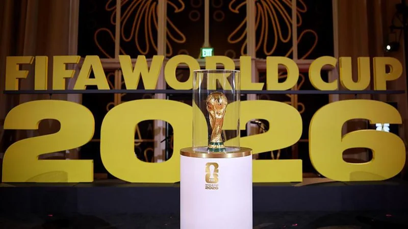 A picture of the Fifa World Cup trophy in front of the words Fifa World Cup 2026.