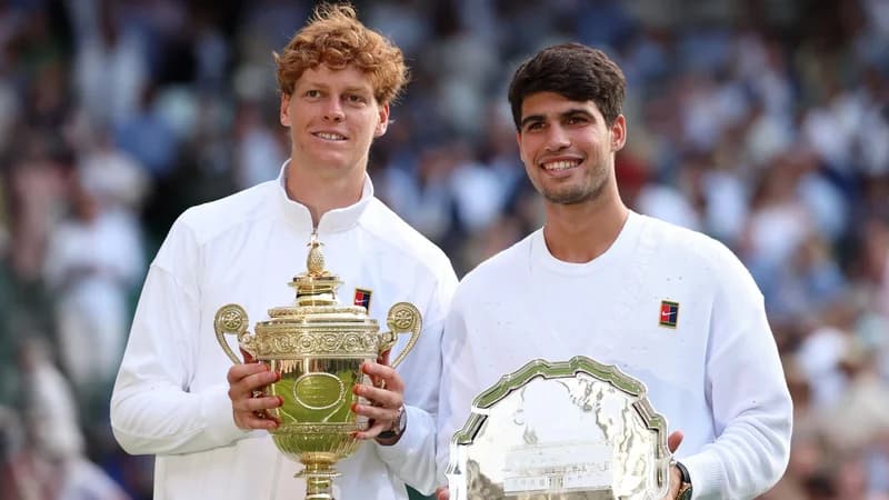 Jannik Sinner and Carlos Alcaraz with the Wimbledon trophies