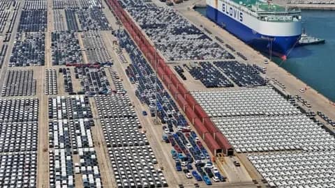 Getty Images Export cars are gathered at a commodity vehicle roll on/roll off terminal waiting to be loaded onto a ship in Yantai, Shandong, China on May 11, 2026