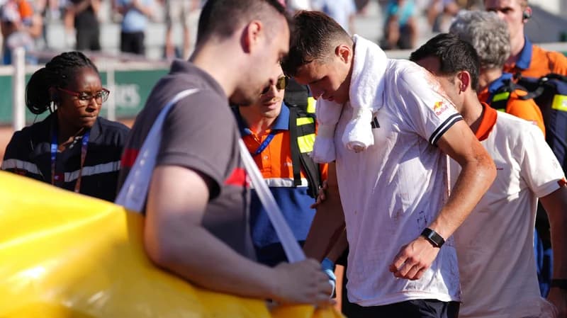 Jakub Mensik receives medical attention after his match