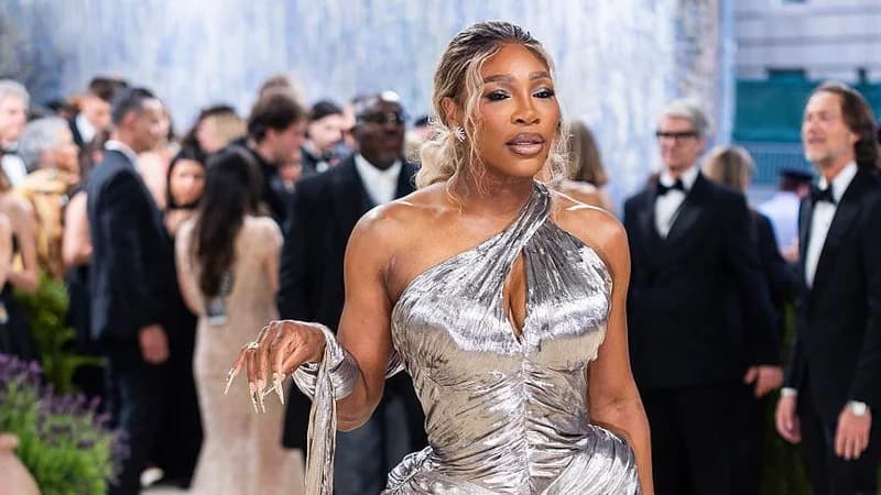 Serena Williams wears a silver dress while attending the Met Gala in early May