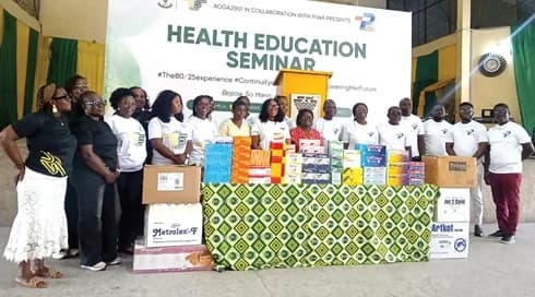 Members of the Aburi Old Girls Association (AOGA) 2001 Year Group and officials of the Pharmaceutical Importers and Wholesalers Association of Ghana (PIWA) with the donated medical supplies after the health education seminar