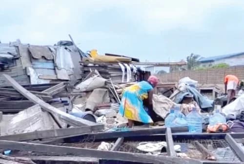 Some of the affected persons sifting through the rubble to salvage what was left of their belongings