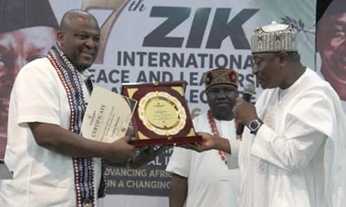Abbas Umar Masanawa (right), the Chairman, Central Planning Committee of the Zik International Leadership and Peace Awars, handing the award to Ibrahim Mahama, the CEO of the Dzata Cenent Company Limited, during the ceremony