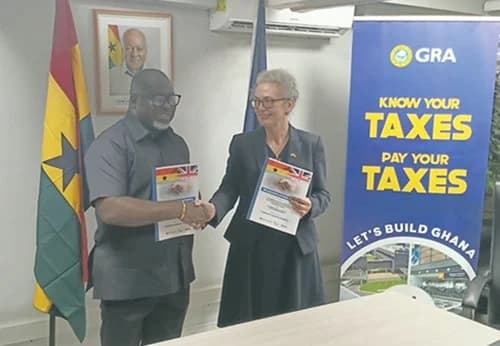 Anthony Sarpong (left), Commissioner-General of GRA, exchanging pleasantries with Terri Sarch, Development Director at the British High Commission