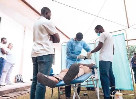 Final year dental students of the University of Ghana Dental School and New York University performing dental cleaning for students of the New Horizon Special School