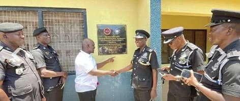 Wenawome Duriyem Aborah (3rd from left), Managing Director of Kacstone Records, in a handshake with ACP Daniel Anane Amoah, the Navrongo Divisional Police Commander, to mark the handing over of the facility, while other police commanders watch on