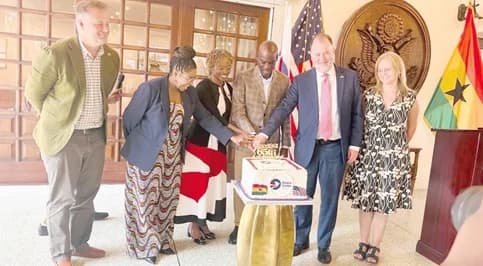 Haruna Iddrisu (3rd from right), Minister of Education, cutting the 65th anniversary cake with Glenda Green (3rd from left), Chief of Operations of Peace Corps Washington, Rolf Olson (2nd from right), Chargé d’Affaires of the United States Embassy in Ghana, Tamu Daniel (2nd from left), Country Director of Peace Corps Ghana, at the event