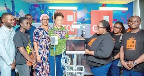 Agnes Owusu-Afram (right), Divisional Head, Corporate Communication and Experience, GTBank Ghana, presenting the items to Dr Charlyne Kilba (4th from left), Head, Department of Child Health, Greater Accra Regional Hospital. With them are officials of the bank and the hospital