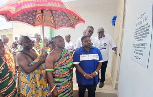 Nana Owiredu Wadie I (right), Founder of Kabaka Foundation, and Daasebre Kwaku Boateng III (2nd from right), Omanhene of New Juaben, after unveiling the plaque to officially hand over the facility in Koforidua INSET: The building