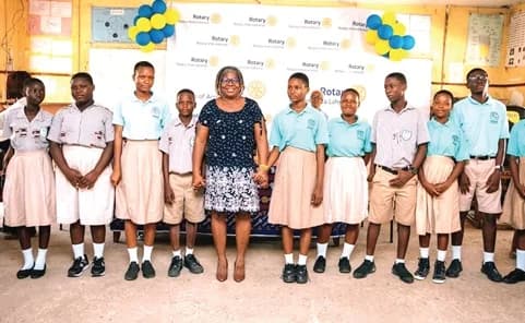 Mercy Odzawo, President of the Rotary Club of Accra, Labone, and the contesting students of La Yahoushua JHS.