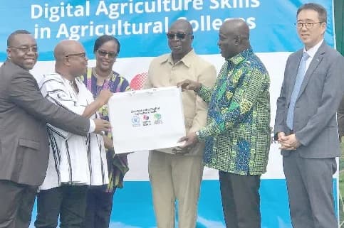 Eric Opoku (2nd right), Minister for Food and Agriculture, presenting a set of the equipment to Albert Appiah Amoakoh (2nd from left), Principal, Kwadaso College of Agriculture, while Dong Wan Woo (right), KOICA Country Director, and Aurore Rusiga (3rd from left), Country Director, WFP look on