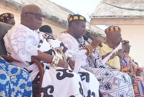 Togbi Zewu IV (middle), chairman of the festival central planning committee, reading Awadada’s speech at the launch