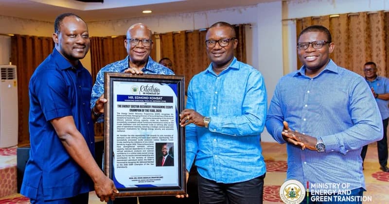 A group of four men are pictured at an official award ceremony where Mr. Edmond Kombat, the Managing Director of Tema Oil Refinery (TOR), is being presented with a framed citation. The citation honors him as the Energy Sector Recovery Programme (ESRP) Champion of the Year for 2026, signed by the Minister for Energy and Green Transition.