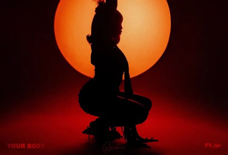 The image features a silhouette of Ghanaian singer Gyakie crouching against a large, glowing orange circular backdrop. The moody, red-toned composition serves as the official cover art for her single 'Your Body'.