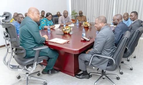 Samuel Okudzeto Ablakwa (left), Minister of Foreign Affairs, and Rev. Dr Stephen Wengam (right), General Superintendent of the Assemblies of God, Ghana, in a chat while their team members look on