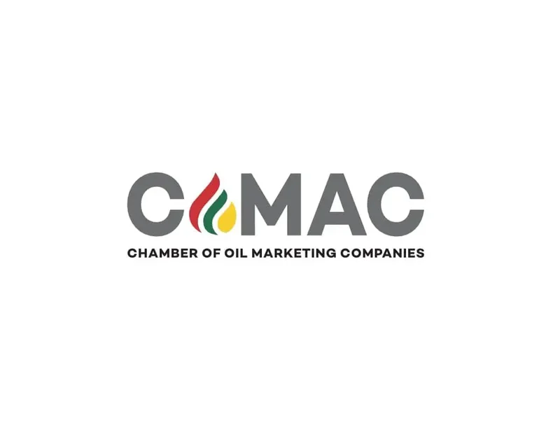 The image displays the official logo of the Chamber of Oil Marketing Companies (COMC) in Ghana. The logo features the acronym 'COMC' in bold gray font with a flame graphic in red, green, and gold colors, followed by the organization's full name in black capital letters on a plain white background.