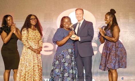 Rita Rockson (middle), Head of Sustainability and CSR, receiving the award on behalf of Telecel Ghana from Guillaume Valence (2nd from right), President of the Board of CCI France Ghana