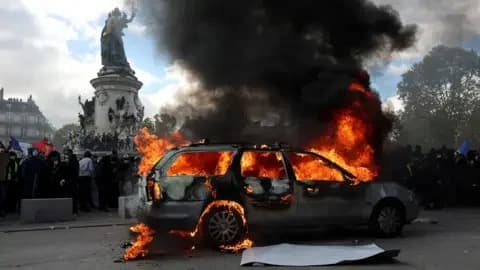 Reuters A car burns amid clashes between protesters and the French police during a demonstration against the cost of living and rising fuel prices at the Place de la Republique in Paris