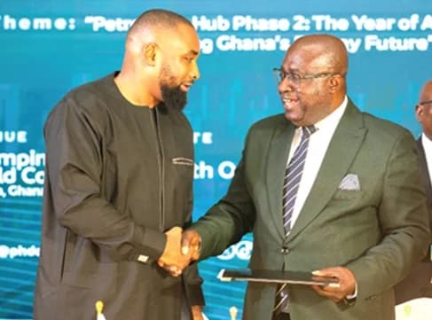 Dr Toni Aubynn (right), CEO, Petroleum Hub Development Corporation, shaking hands with Boubacar Belco Bah (left), Representative of Investment Consortium, after signing the agreement. Picture: ELVIS NII NOI DOWUONA