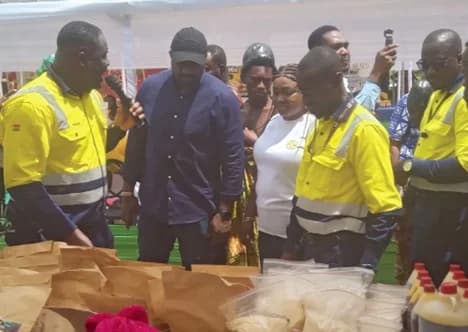 Daniel Arthur-Bentum (left), Economic Sustainability Lead, AngloGold Ashanti Ghana, describing some of the products on display at the fair to John Dumelo (2nd from left), Deputy Minister of Food and Agriculture, while Samuel Boakye Pobee (right), Managing Director, AngloGold Ashanti Obuasi Mine, looks on