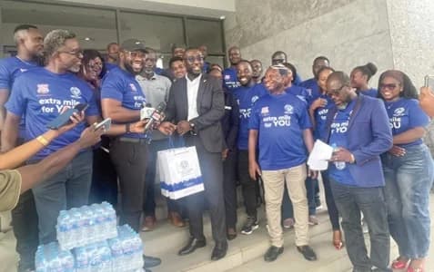 Dr Richard Appiah Otoo (2nd from left), Chief Regional Manager of GWL, Accra East, presenting the items to Delali Gaisie (3rd from left), General Manager of The Palms by Eagles Airport City, during the visit