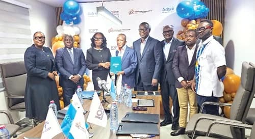 Abena Osei-Poku (3rd from left), MD, Ecobank Ghana, and Isaac Ofori-Poku, Group Chairman, IOP Group and Executive Chairman, Ghana Bauxite Company, holding the signed documents. With them are other officials of Ecobank and Ghana Bauxite Company. Picture: DOUGLAS ANANE-FRIMPONG